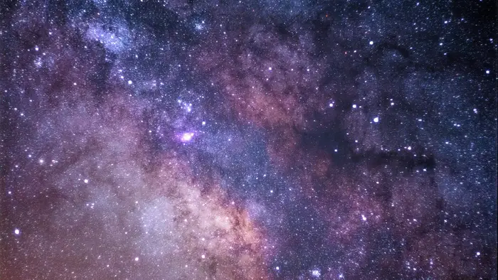 A telescope pointed at the night sky, the kind of instrument that reveals the Moon's slow libration over a month