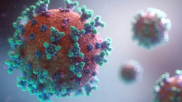 A stylized 3D rendering of a germ particle covered in surface spikes